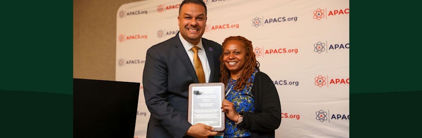 Dr. Renaldo D. Alba, President of the Association for Program Administrators of CSTEP and STEP, Inc. (APACS) presenting Monique Clark-Ciceron with her award.