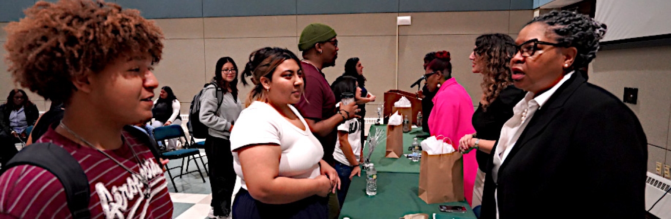 Photo of Students talking to First Generation Panel members