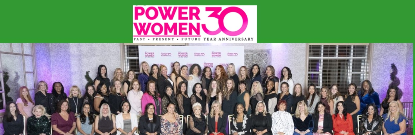 Group photo of more than 40 women dressed professionally