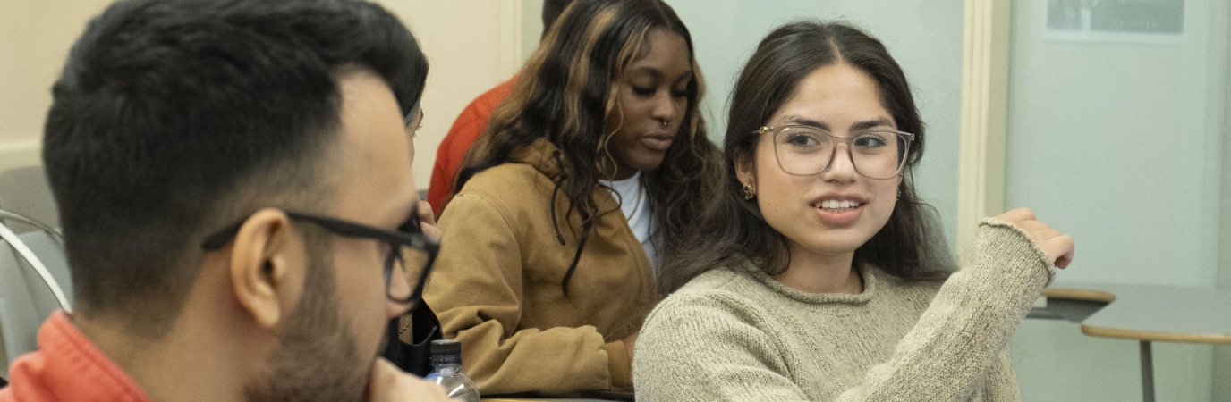 Female and male student in discussion