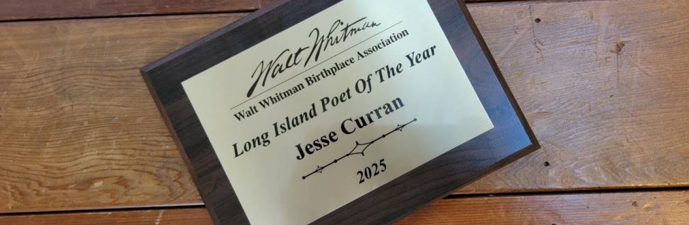 A plaque that reads Jesse Curran, 2025 Long Island Poet of the Year