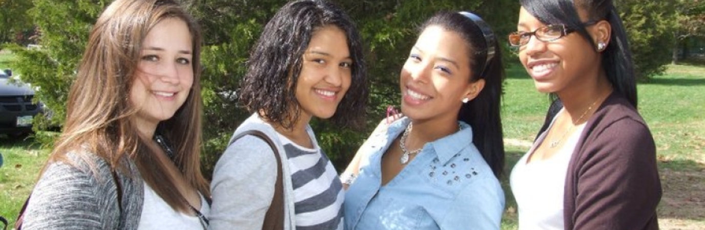 4 OW Students Students posing for a picture on a beautiful day at Old Westbury