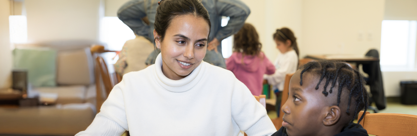 School of education literacy clinic a female student teacher is looking at a male student
