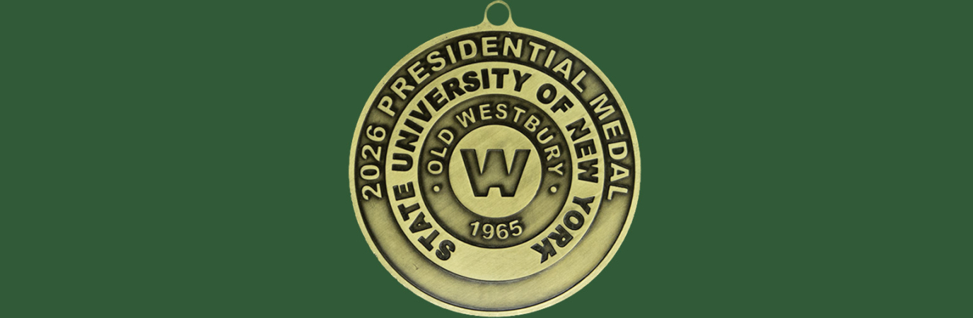 Round, gold medal on a green background inscribed "SUNY Old Westbury Presidential Medal"