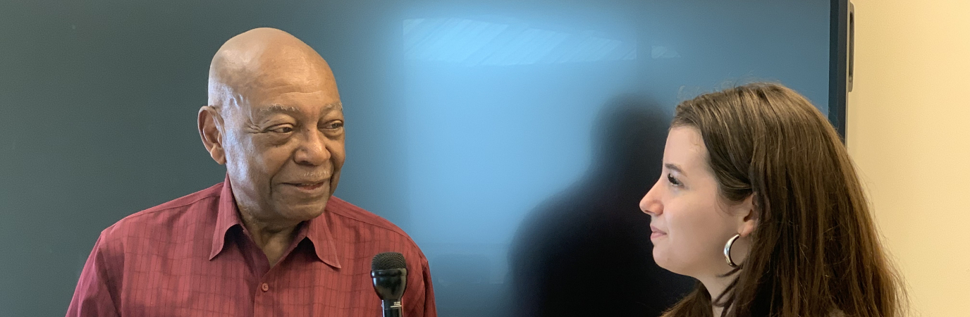 Reporter Ann Bunch interviewing Prof. Denton Watson