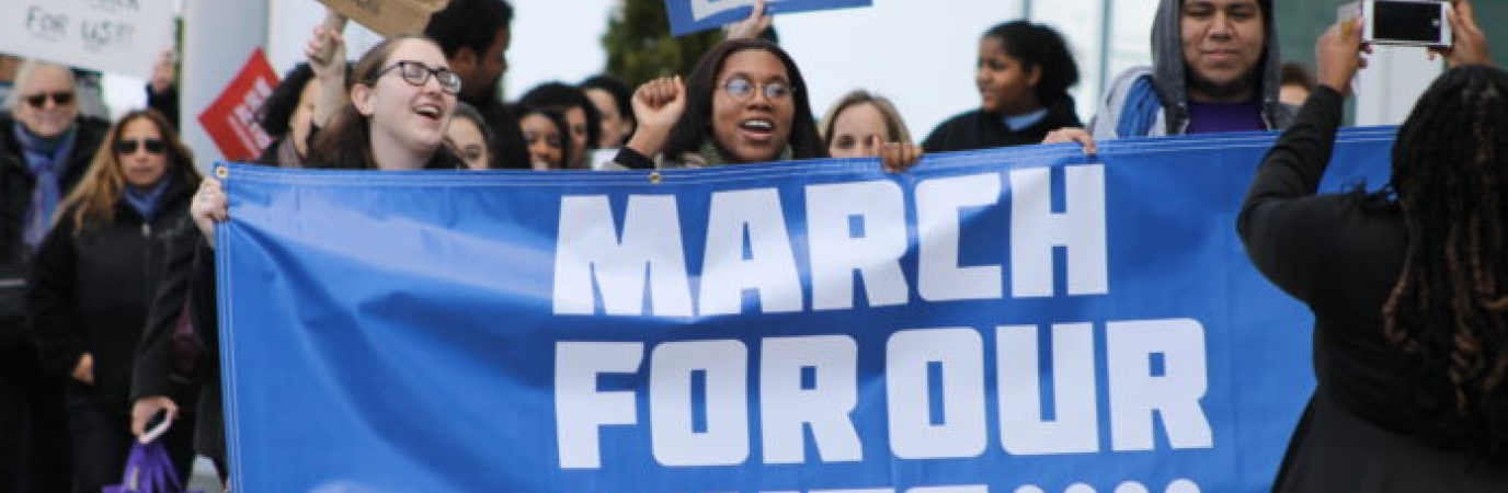 Students holding March For Our Lives banner