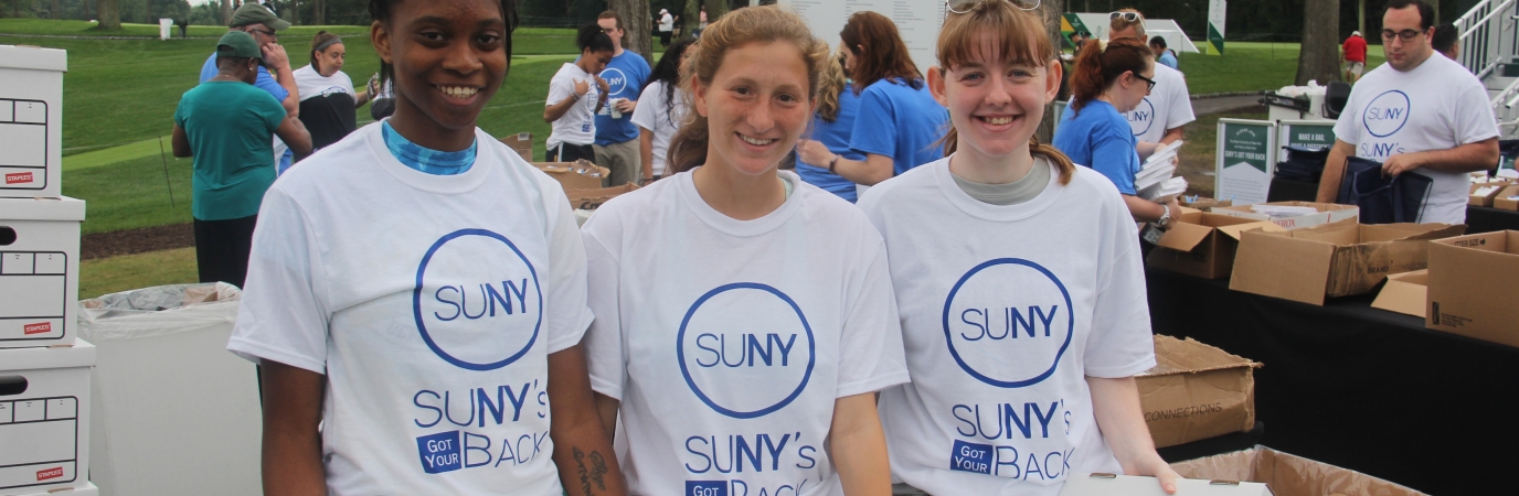 Three volunteers in SUNY's Got Your Back tee shirts