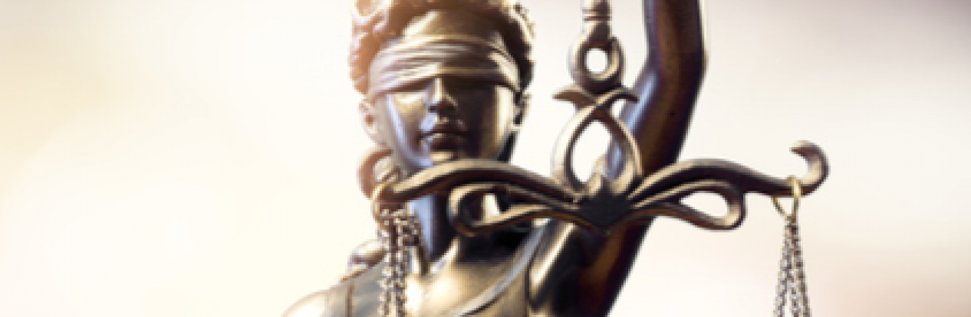 A silver version of the scales of justice female character