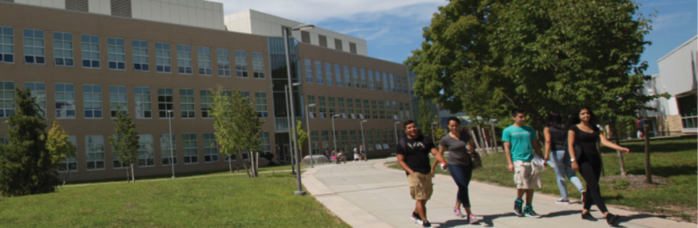 Students walking in front of the Academic Building