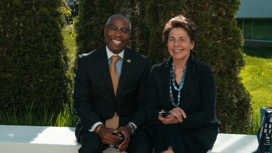 President Sams sits with Chair Tisch outside the Campus Center