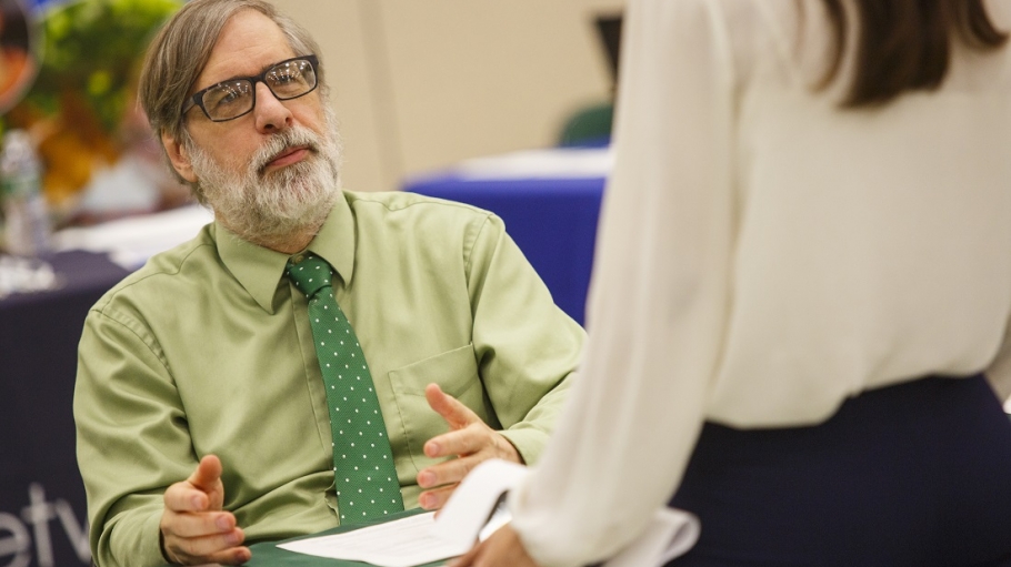 School of Professional Studies Director Ed Bever in conversation with a student