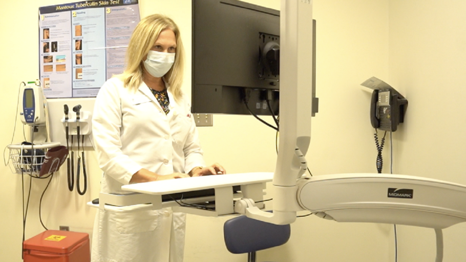 Director of Student Health recording patient data