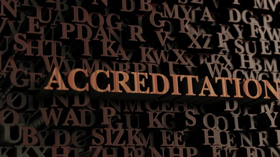 Jumbled brown letters with the word Accreditation highlighted