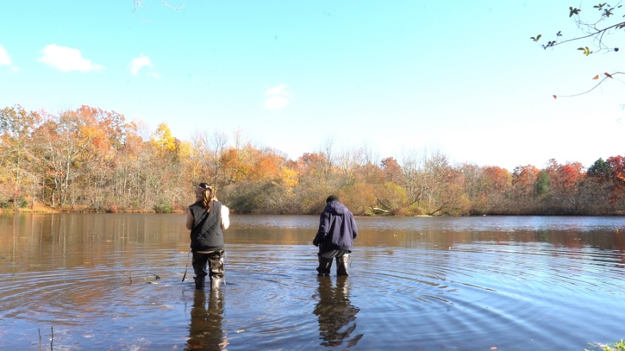 Two students wading in Wantagh waterway