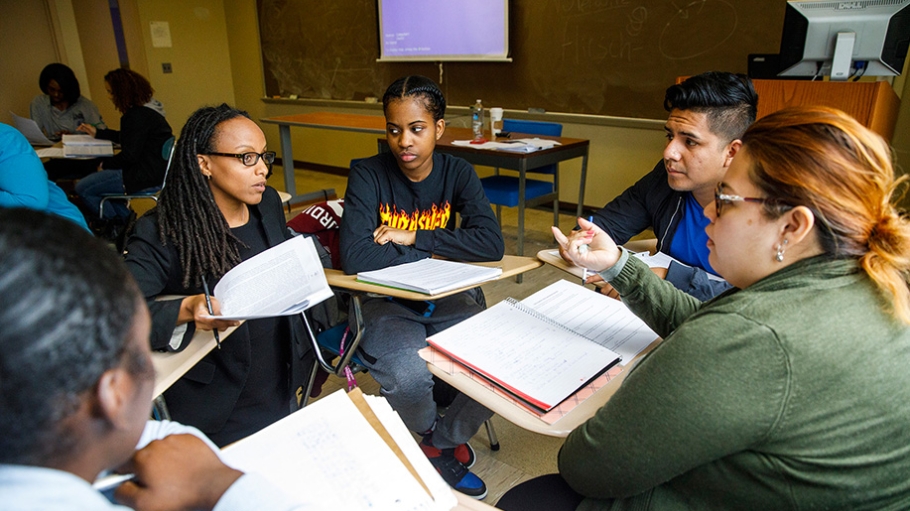 Dr. Rahwa Haile with students at desks in classroom
