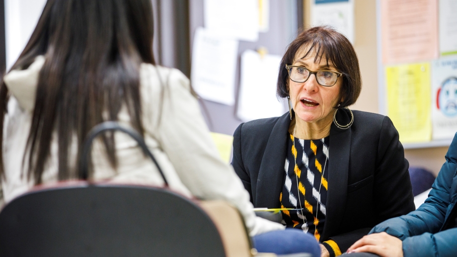 Distinguished Service Professor Laura Anker advising a student