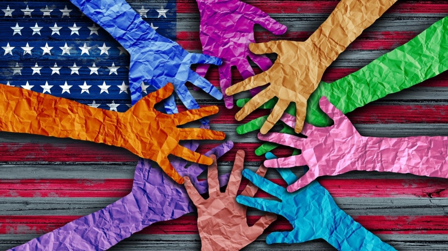 Photo illustration with hands of different colors meeting over an American Flag