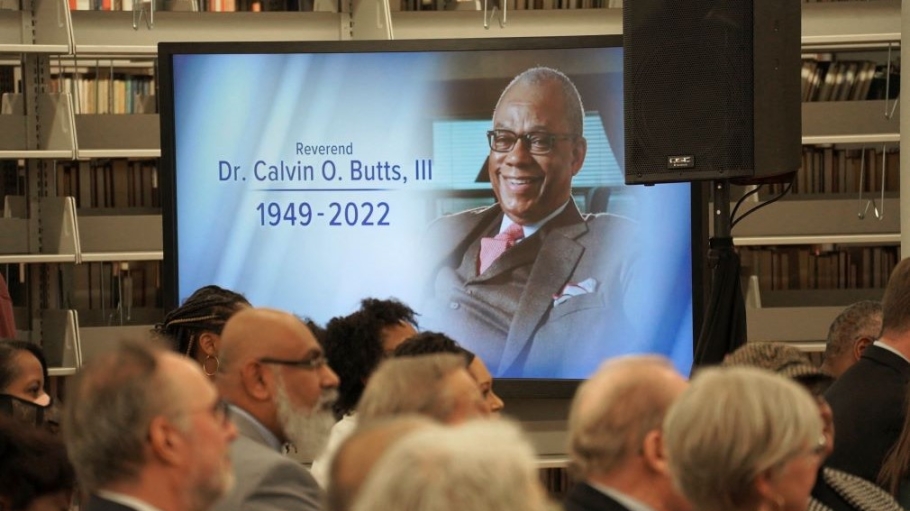 image on LED screen of Dr. Butts with the dates of his birth and death