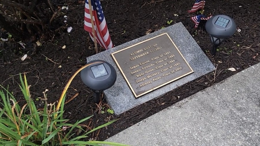 Plaque listing the names of five alumni lost on 9/11/01