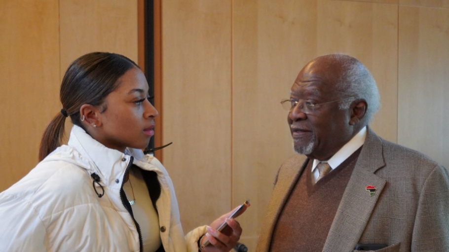 Photo of a SUNY Old Westbury Student speaking with Dr. Julius Garvey  