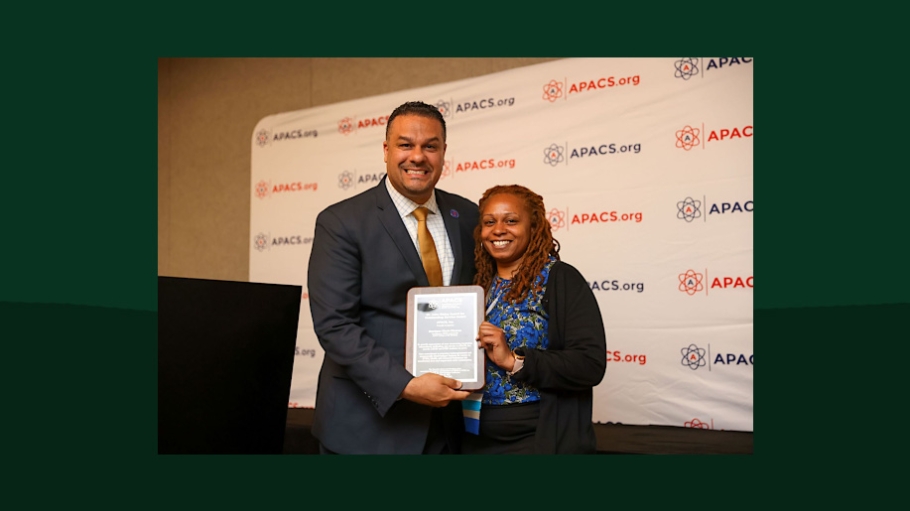 Dr. Renaldo D. Alba, President of the Association for Program Administrators of CSTEP and STEP, Inc.  (APACS) presenting  Monique Clark-Ciceron with her award.