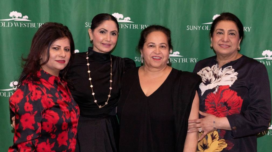 Four South Asian women in formal dress