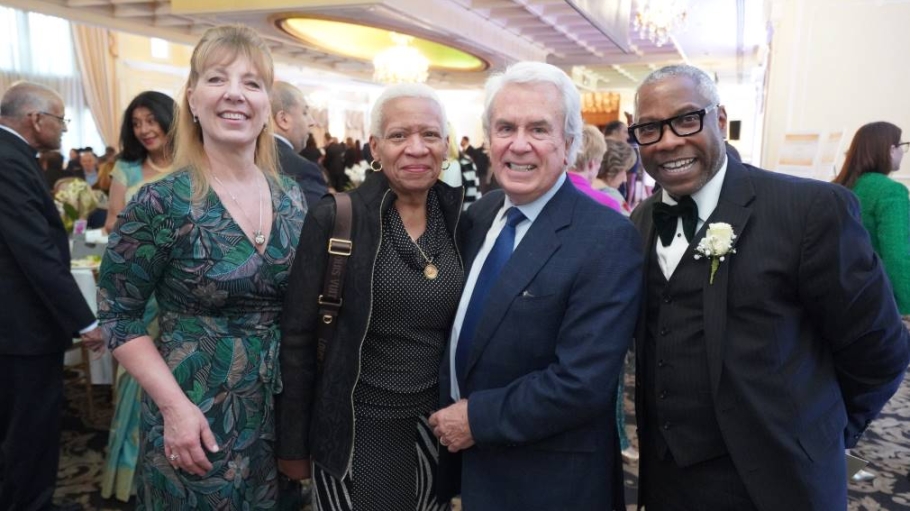 Two women and two men smiling for the camera