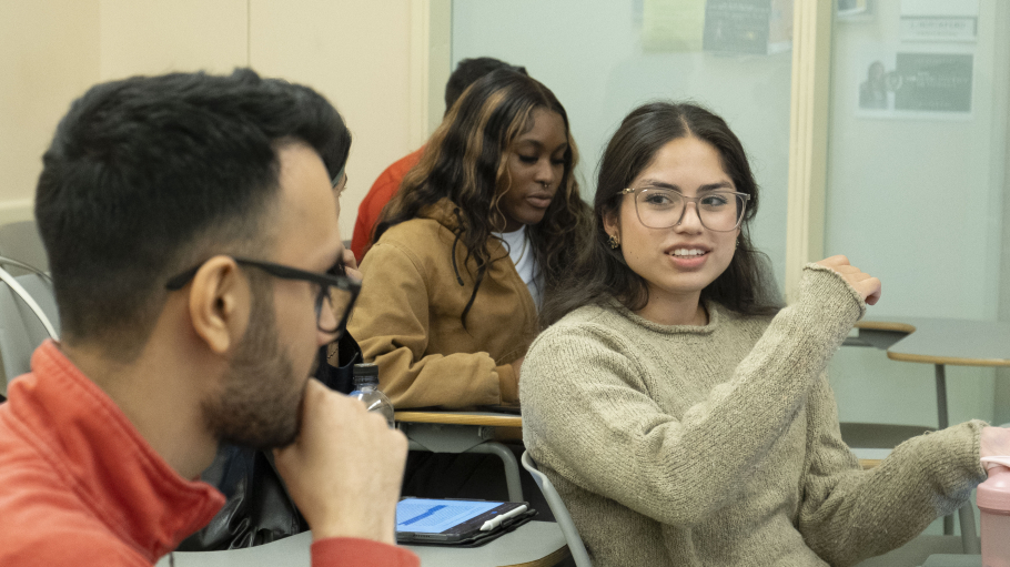 Female and male student in discussion
