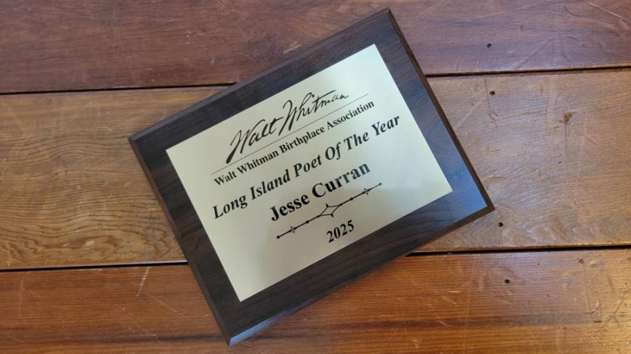 A plaque that reads Jesse Curran, 2025 Long Island Poet of the Year
