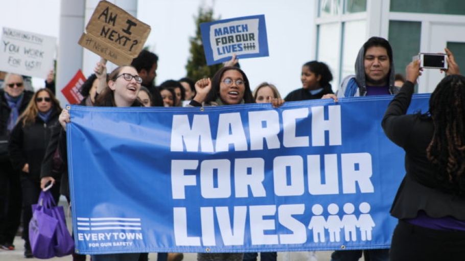 Students holding March For Our Lives banner