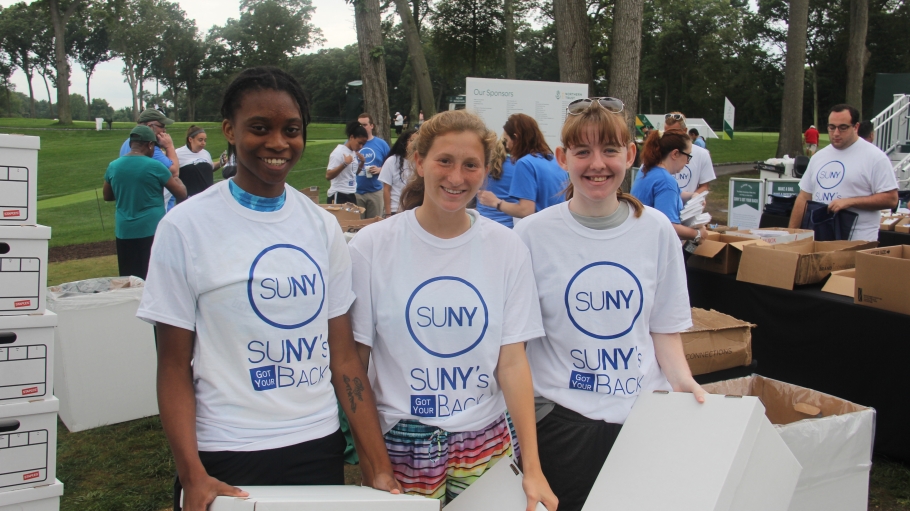 Three volunteers in SUNY's Got Your Back tee shirts