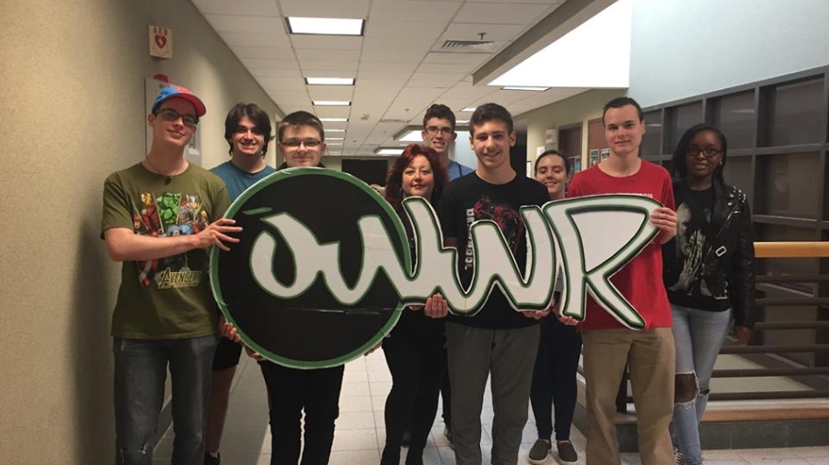 Participants in Project Stewardship holding OWWR logo cutout