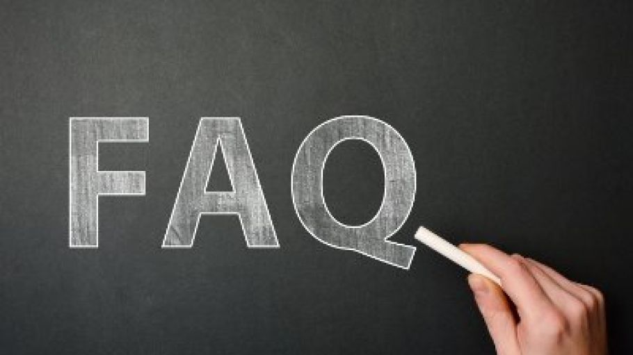 FAQ written on blackboard with chalk