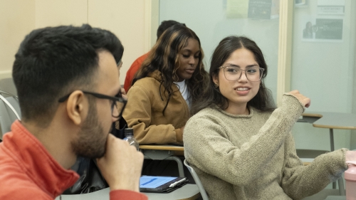 Female and male student in discussion