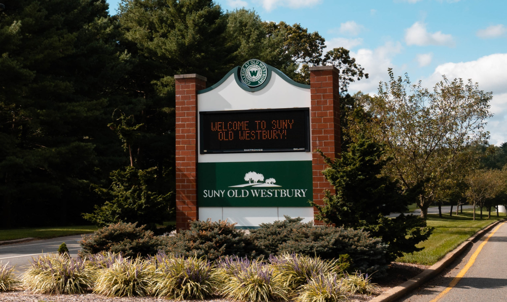 LED sign at Main College Entrance as it reads "Welcome to SUNY Old Westbury"