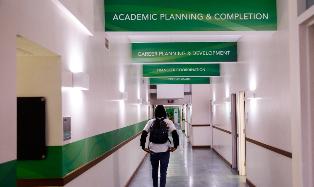 Student walking in Success Center Hallway