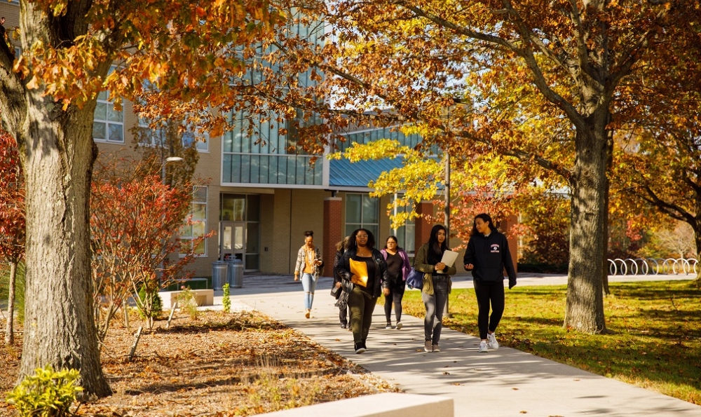 Students walking in front of NAB on a fall day