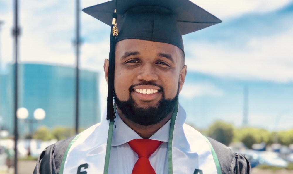 STEP student Ian Febres in cap and gown