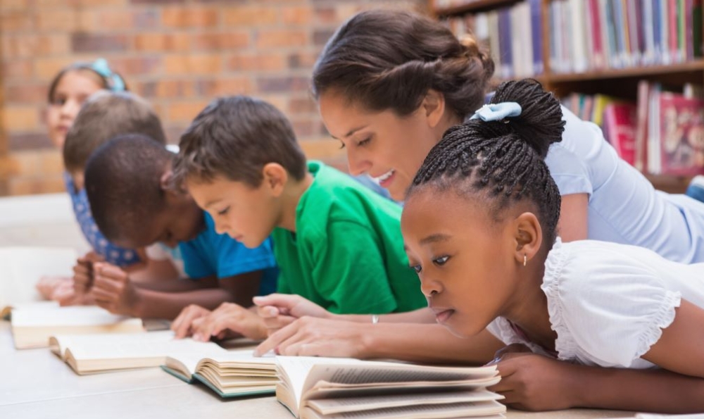 Teacher reading with young students