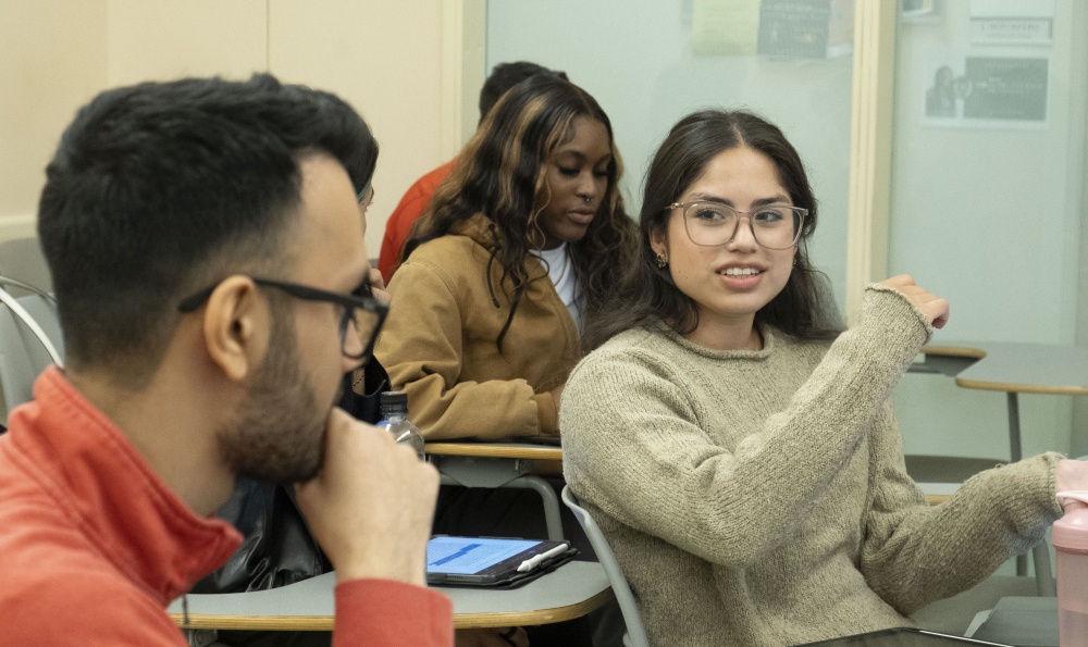 Female and male student in discussion