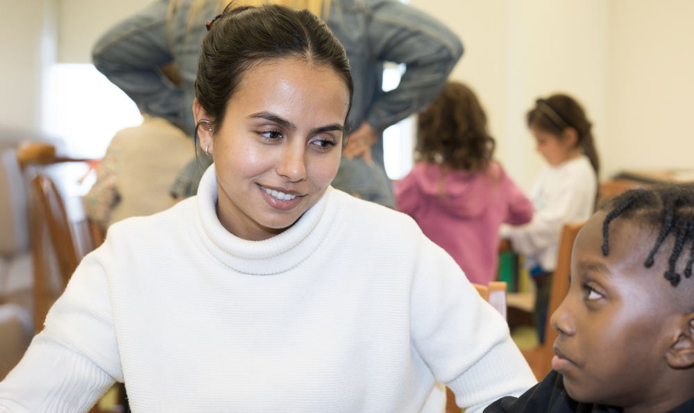 School of education literacy clinic a female student teacher is looking at a male student