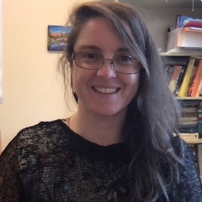 Headshot of Jennie D'Ambroise in a black shirt