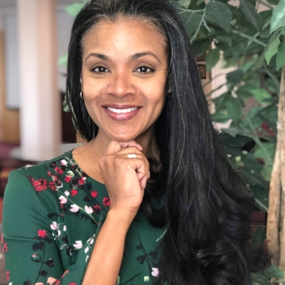 Dr. Roxanne Garcia- France headshot with her hand posed under her chin